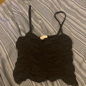 This is a black ruffle crop top . It’s causal